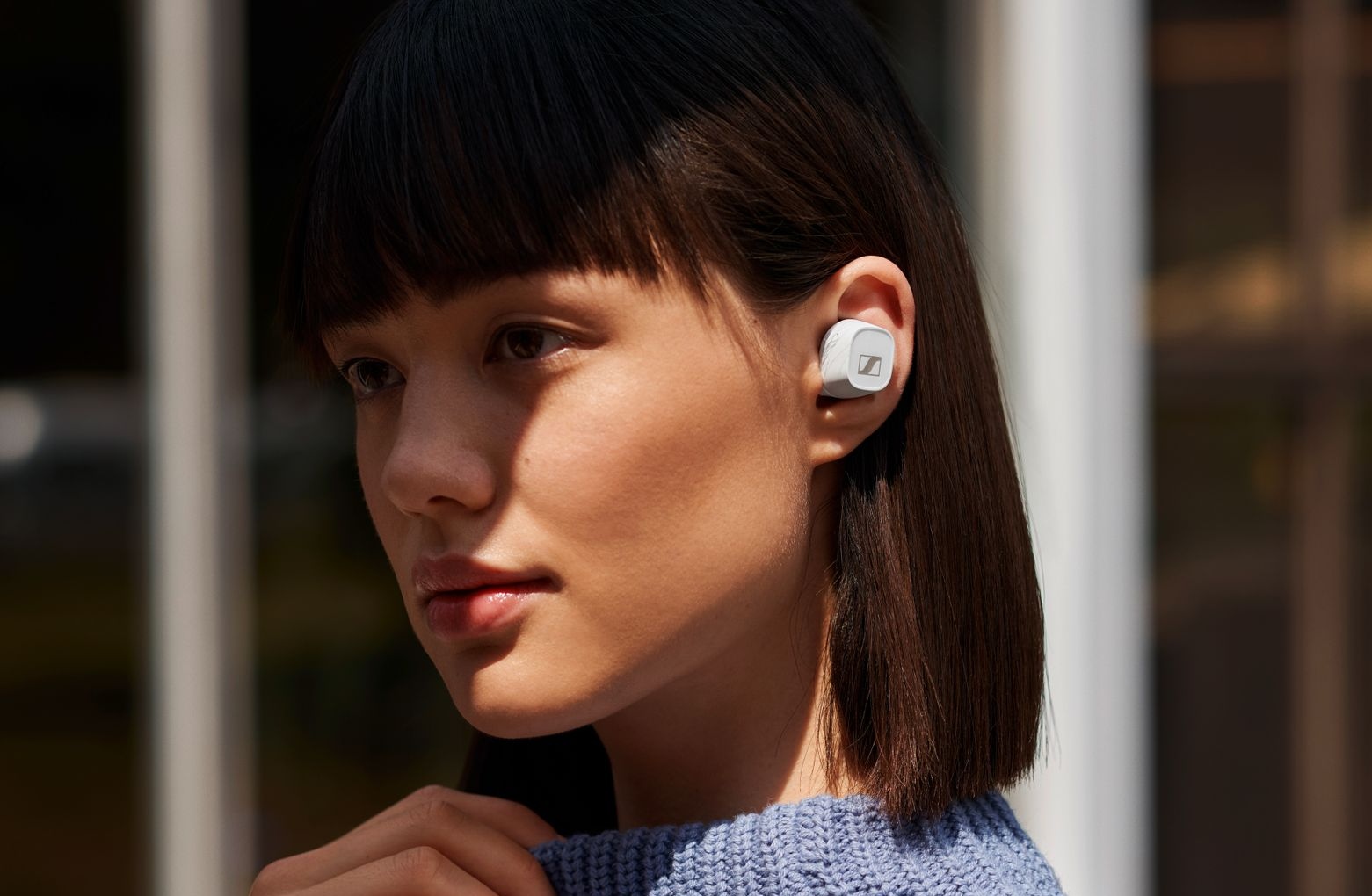 Sennhesier CX-400BT wireless earbuds worn by a young lady